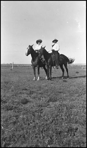 [Man and woman on horseback]