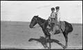 Photograph: [Two boys on horseback]