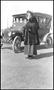 Photograph: [Kay Shuey Palm standing by an automobile]