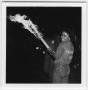 Primary view of [Talon Club member with bonfire torch, 1983]