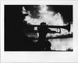 Thumbnail image of item number 1 in: '[Trumpet player silhouetted against North Texas Homecoming bonfire, 1987]'.