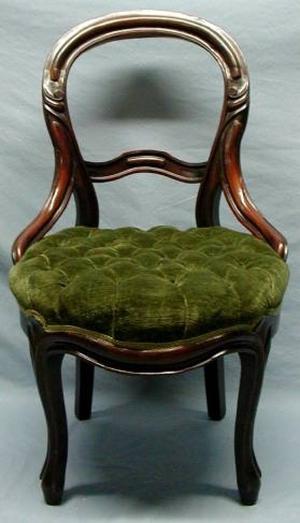 [Walnut cameo backed love seat with tufted green velvet upholstery.]