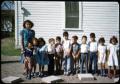 Photograph: [Photograph of Children in Front of White Building]