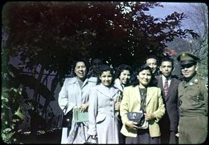 [Photograph of a Group standing Outdoors]