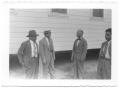 Thumbnail image of item number 1 in: '[Four Men in Front of an Elevated House]'.