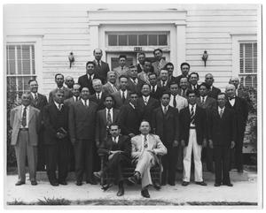 [Group of Hispanic Men in Front of a White Building]