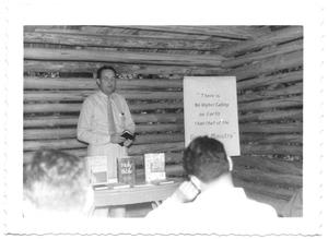 [Man Teaching the Bible in a Log Cabin]