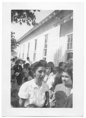 Primary view of object titled '[Hispanic Girl Standing in a Convention Line]'.
