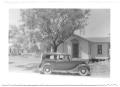 Photograph: [Car Parked in Front of a House]