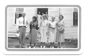 Primary view of object titled '[Group of People Standing at the Entrance of a Presbyterian Church]'.