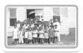 Thumbnail image of item number 1 in: '[Class of Young Children Standing in Front of a Church]'.