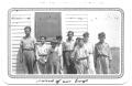 Photograph: [Group of Boys Standing in Front of a Window]
