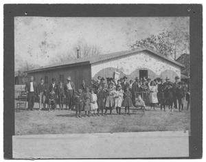 [Large Congregation in Front of a Wood-Slatted Church]