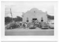 Photograph: [Cars and People Gathered Around the Front of a Church]