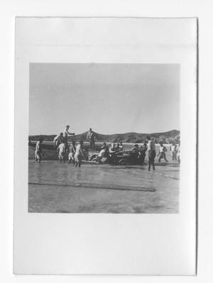 Primary view of object titled '[Sailors Offloading a Vehicle from a Dinghy]'.