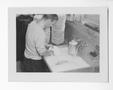 Photograph: [Man Washing A Dish]