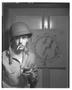 Photograph: [Negative of Soldier Smoking by Dart Board, #1]