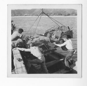 Primary view of object titled '[Soldiers Bringing Suspended Jeep to Dock, #2]'.