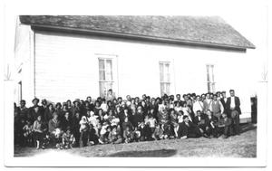 [Large Group of Hispanic People Posed in Front of a Building]