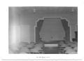 Photograph: [Front View of a Stage with Fold-Up Chairs]