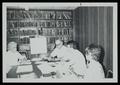 Photograph: [Church Workers at a Desk]