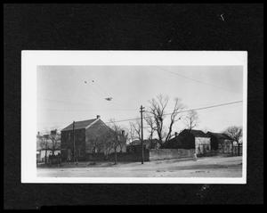 Primary view of object titled '[Photograph of the Doebbler's House and the Crown Saloon]'.