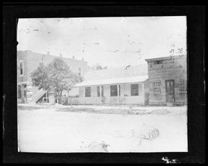 [Photograph of Central Drug, Wehmeyer Bakery, and Ludwig's Boot Shop]