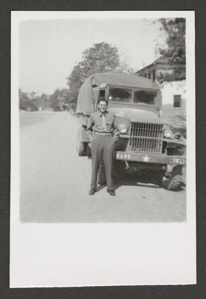 Primary view of object titled '[Man with U.S. Army Band Truck]'.