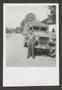 Photograph: [Man with U.S. Army Band Truck]