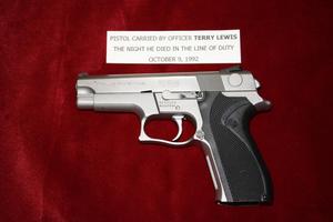 [Image of Arlington Police Officer Terry L. Lewis's pistol]