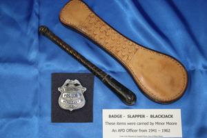[Image of Arlington Police Officer Minor Moore's badge, slapper and blackjack]