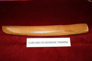 [Image of a wooden club / knife used for APD defensive training, 1950s-1970s]