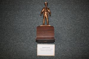 [Image of an APD Awards Statue presented to annual award recipients and retirees]