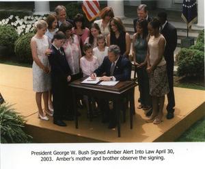 Primary view of object titled '[AMBER Alert: President George W. Bush signs the AMBER Alert into law]'.