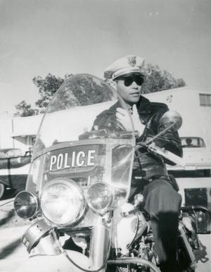 [Arlington Police Officer Homer DeWolfe on motorcycle]