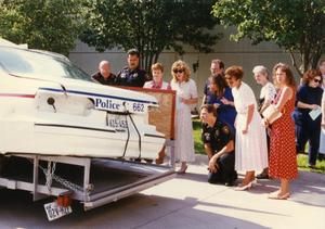 [Arlington patrol car belonging to Officers Lewis and Crocker on display for MADD, 1992, back view]