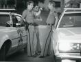 Primary view of [Arlington Police Officers Tom LeNoir and Eddie Thompson speaking to Chaplain Harold Elliott]