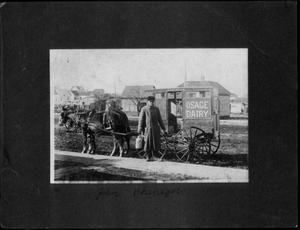 [John F. Phenegar in front of an Osage Dairy wagon]