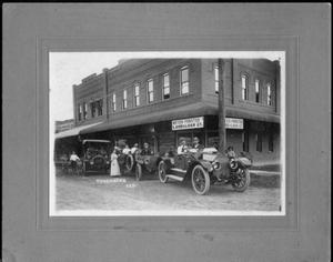 [Three cars in front of Meyer-Forster Land and Loan Co.]