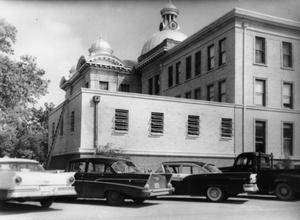 Primary view of object titled '[Fort Bend County Courthouse addition construction, automobiles in front]'.