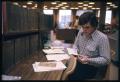 Photograph: [Man Researches at the Library]