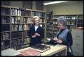 Thumbnail image of item number 1 in: '[Two Women Speak in the Literature Section of a Library]'.