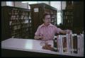 Thumbnail image of item number 1 in: '[Librarian at Book Return Counter]'.