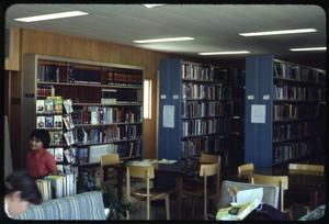 [Library Interior with Blue Bookshelves]