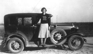 [Frances McNeese Archer standing with car]