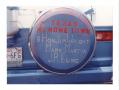 Thumbnail image of item number 1 in: '[Spare tire cover/Hometown sign]'.