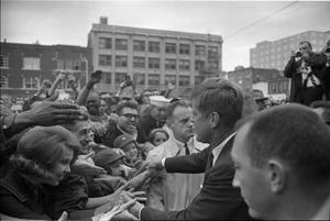 [President Kennedy greeting the crowd outside the Hotel Texas]