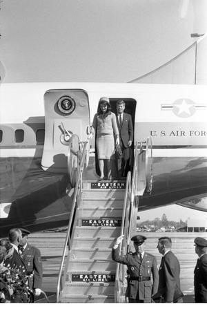 [President and Mrs. Kennedy deplaning at Love Field]