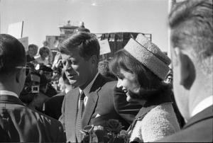 Primary view of object titled '[The Kennedys walking toward the crowd at Love Field]'.