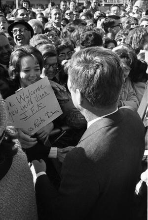 [President Kennedy greeting the crowd at Dallas Love Field Airport]